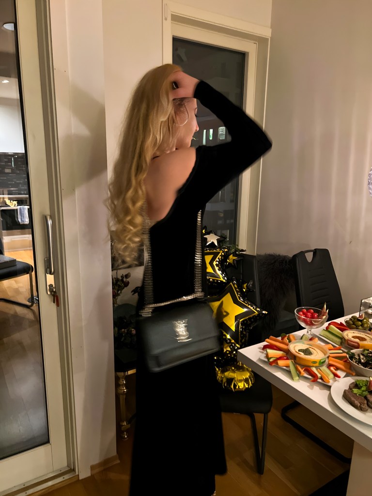 Woman in a black dress at New Years