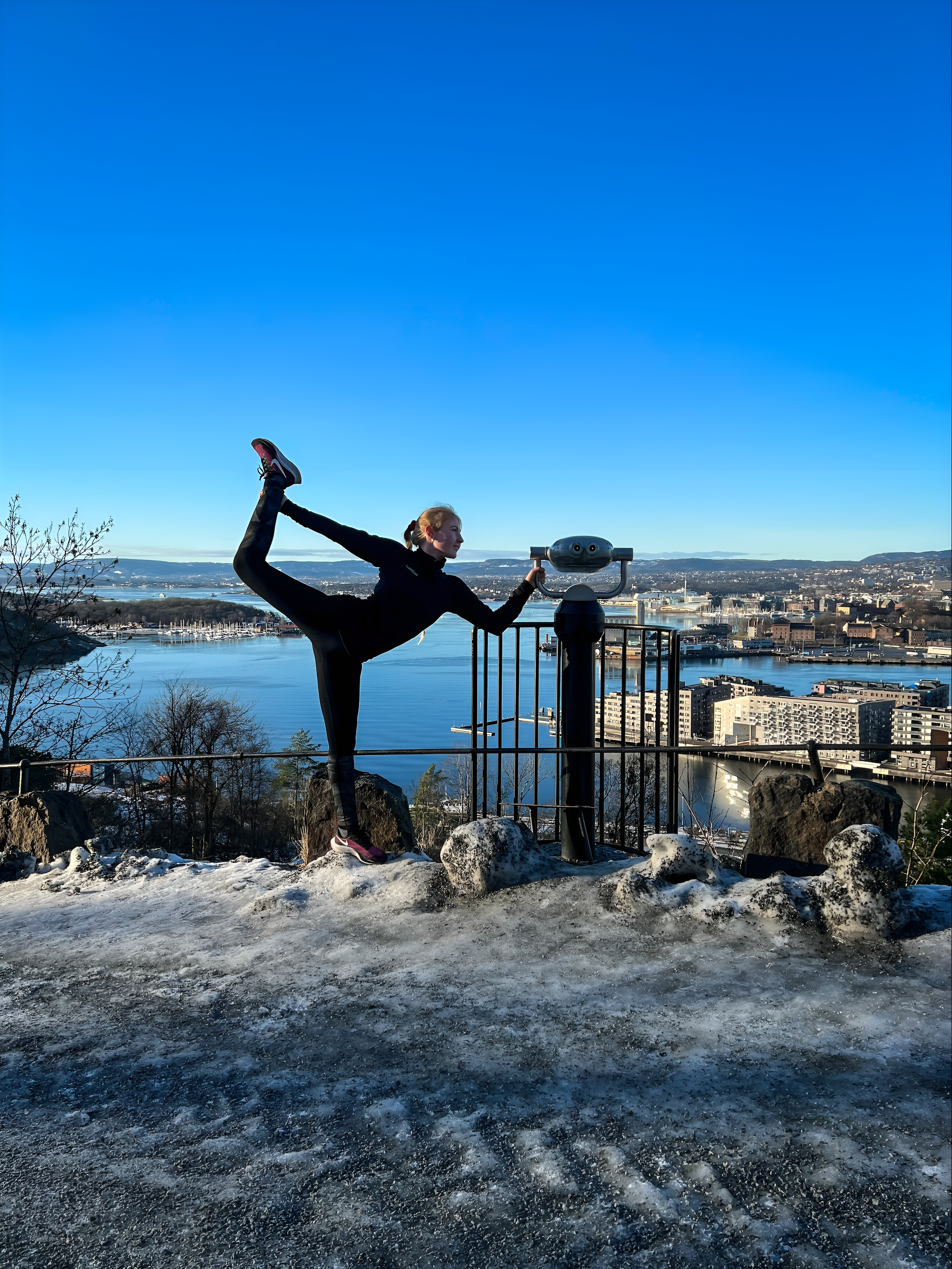 Oslo view with a woman doing a yoga pose