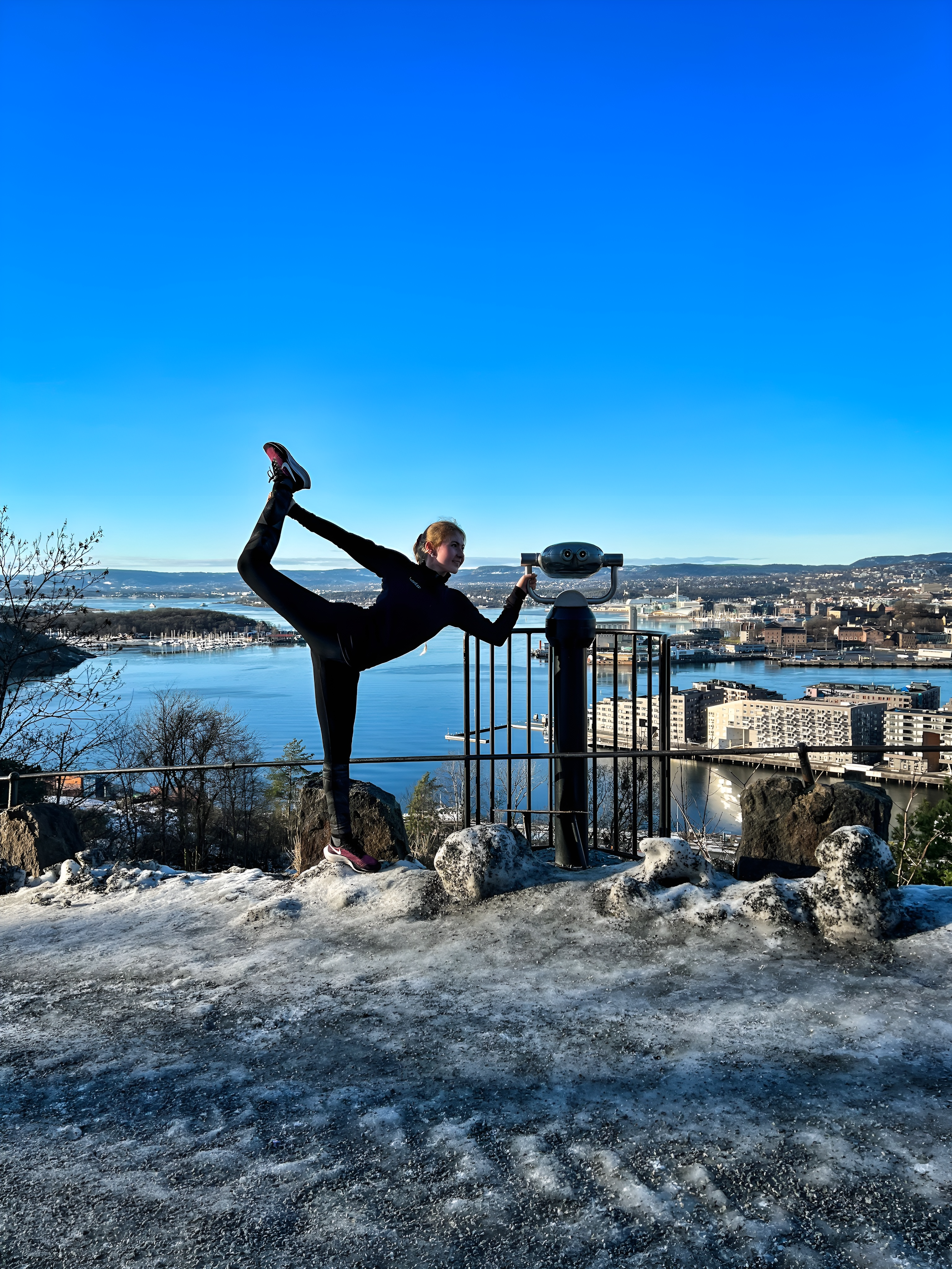 Oslo view with a woman doing a yoga pose