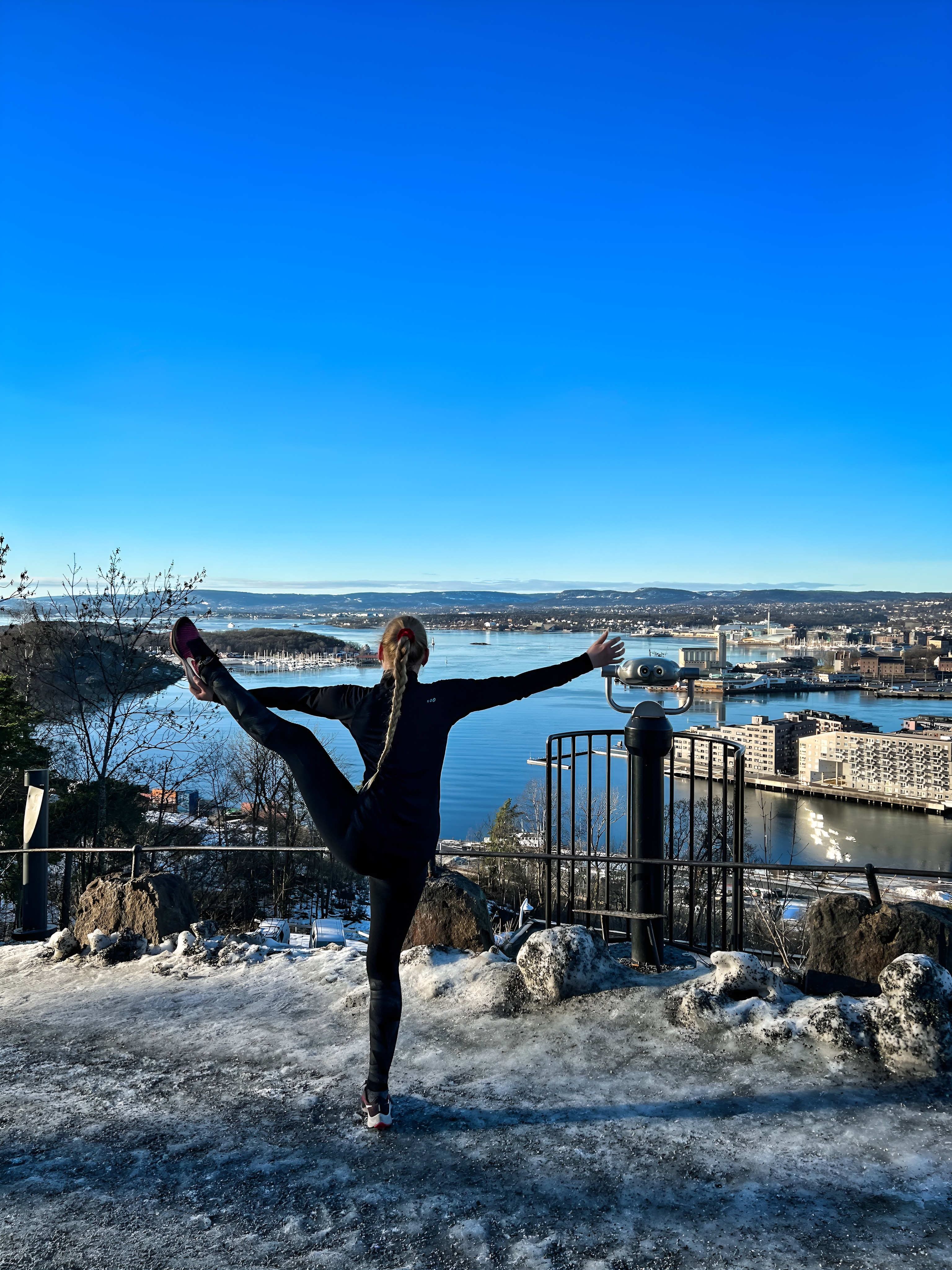 Oslo view with a woman doing a yoga pose