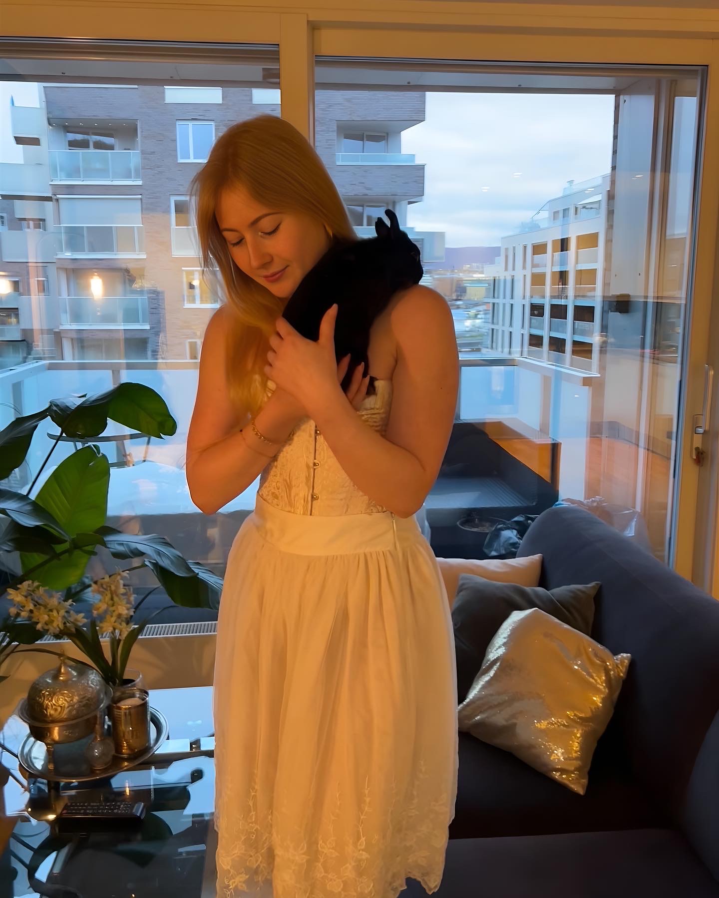 Princess photo in a corset and big skirt posing with her bunny