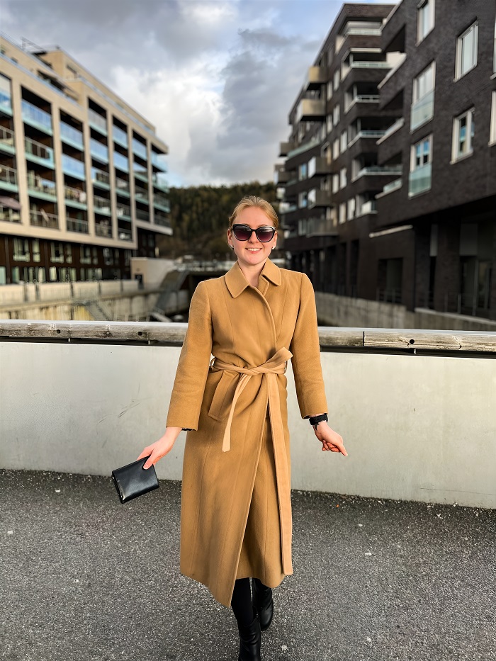 Smiling lady in a trench coat