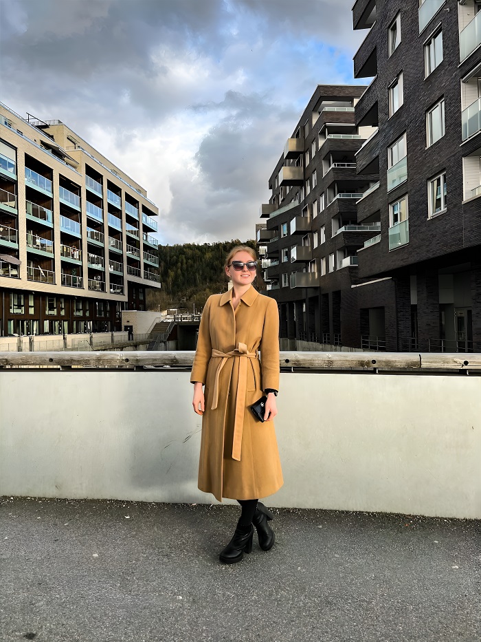 Smiling lady in a coat