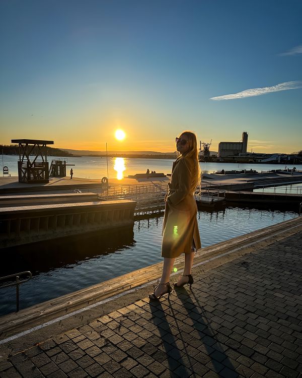 Lady in a coat and heels during sunset