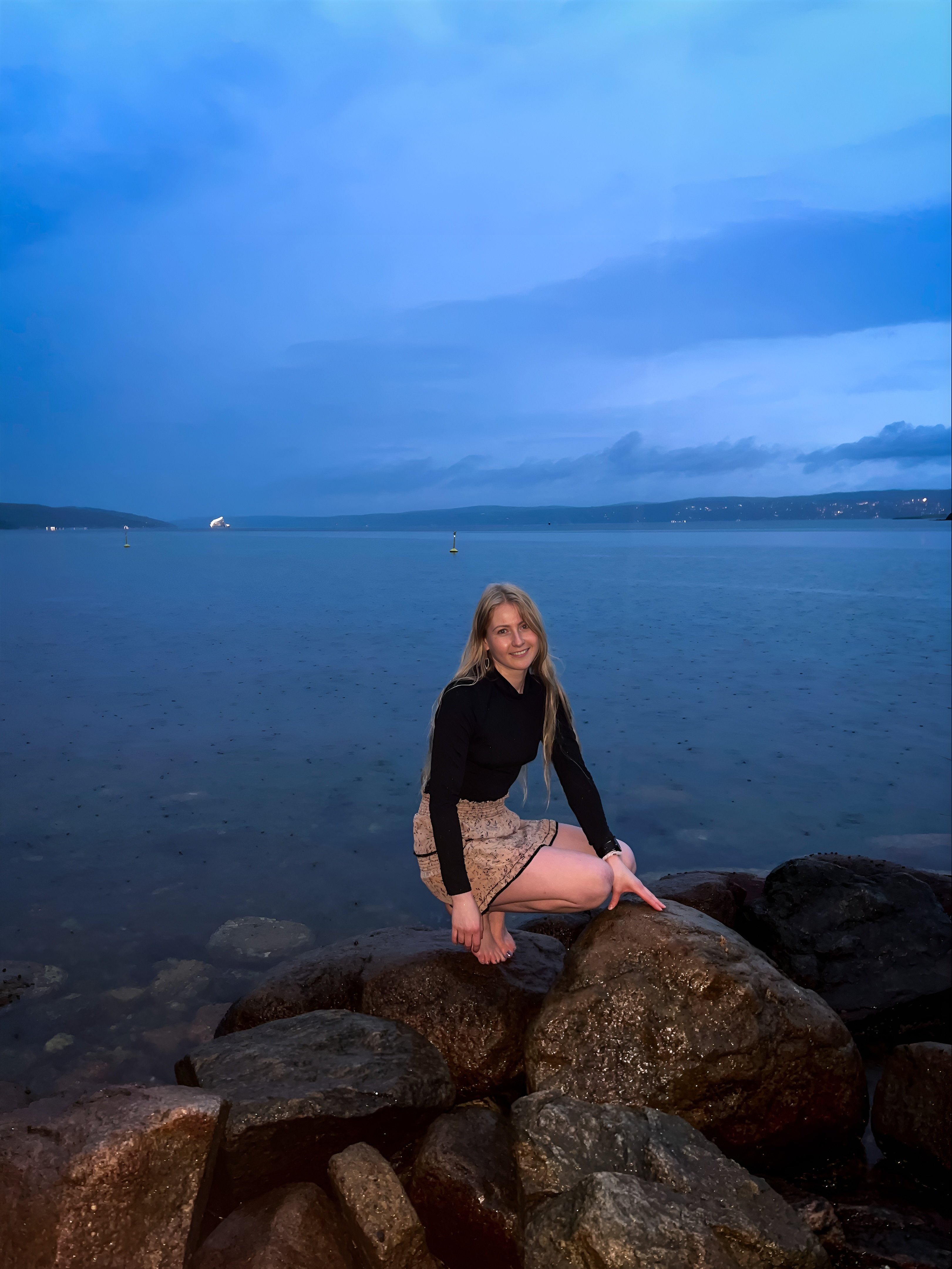 Girl by the sea posing-