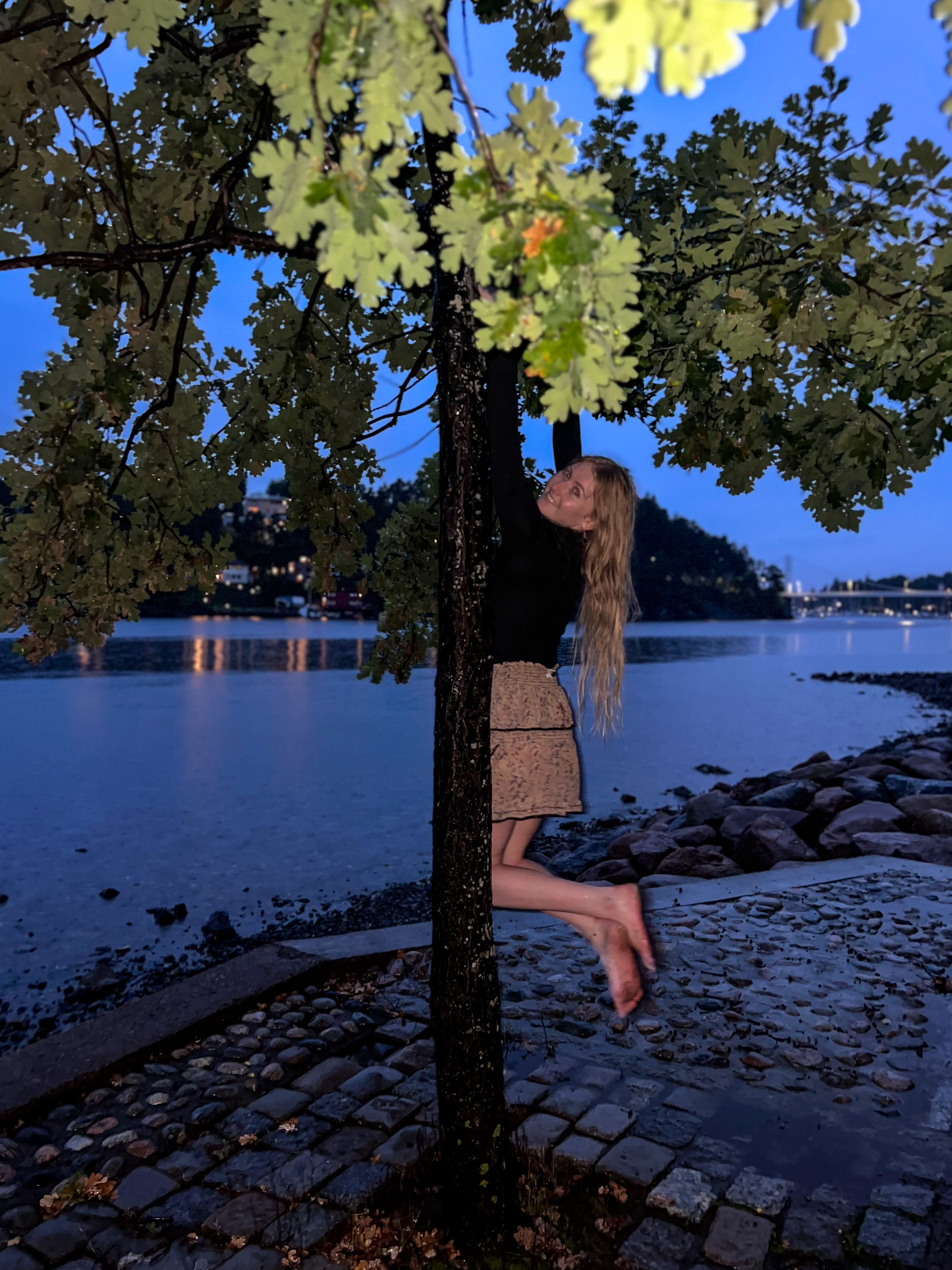 Happy girl haning by the sea