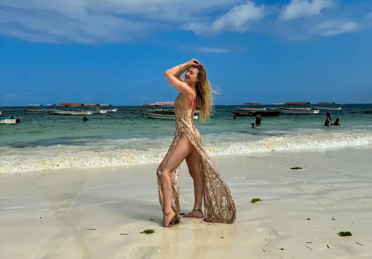 Woman in a rosegold dress at Zanzibar
